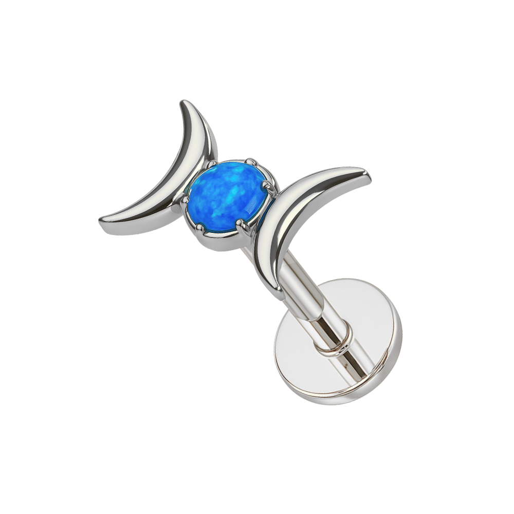 Silver G23 titanium flatback stud with blue opal center and crescent moons. Stylish body jewelry for celestial lovers.