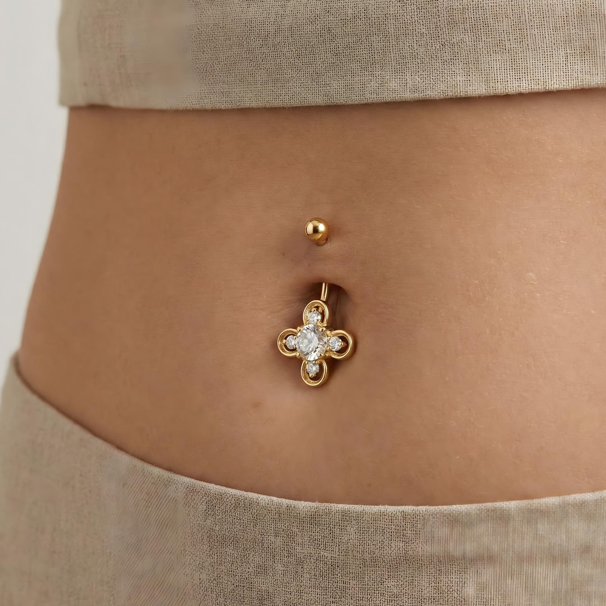 14K Gold Studded Clover Belly Ring worn on a model, showcasing its luxurious clover design and radiant sparkle for stylish navel piercing fashion.