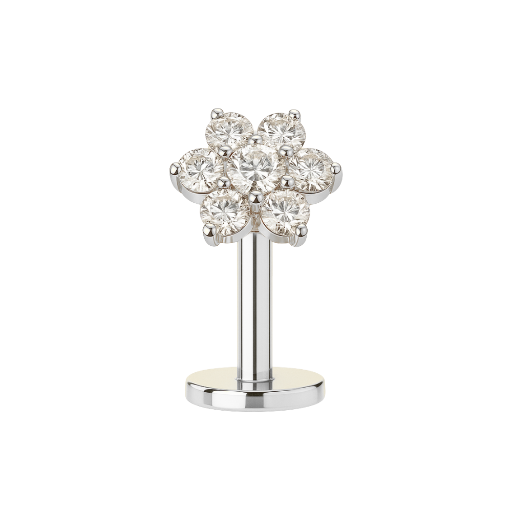 Silver G23 titanium CZ jewelled flower threadless floating belly ring featuring clear crystals in a floral design, perfect for stylish belly piercings.