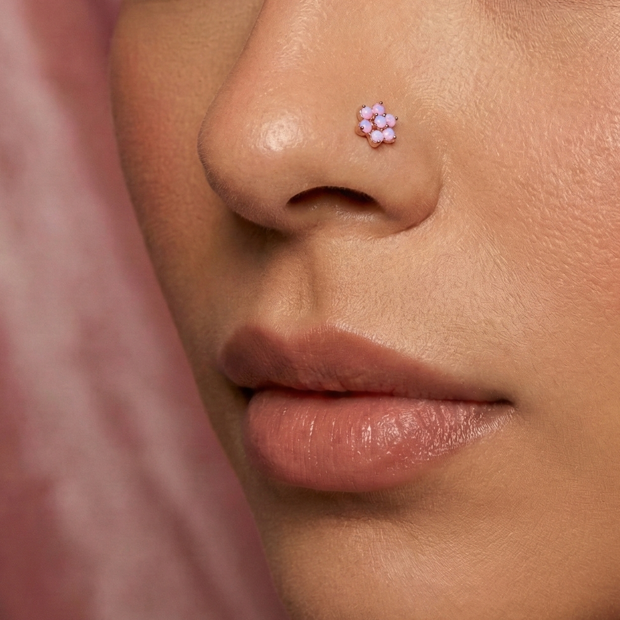Model wearing G23 titanium opal flower threadless nose screw in pink, showcasing elegant and stylish nose jewelry fit for daily wear.