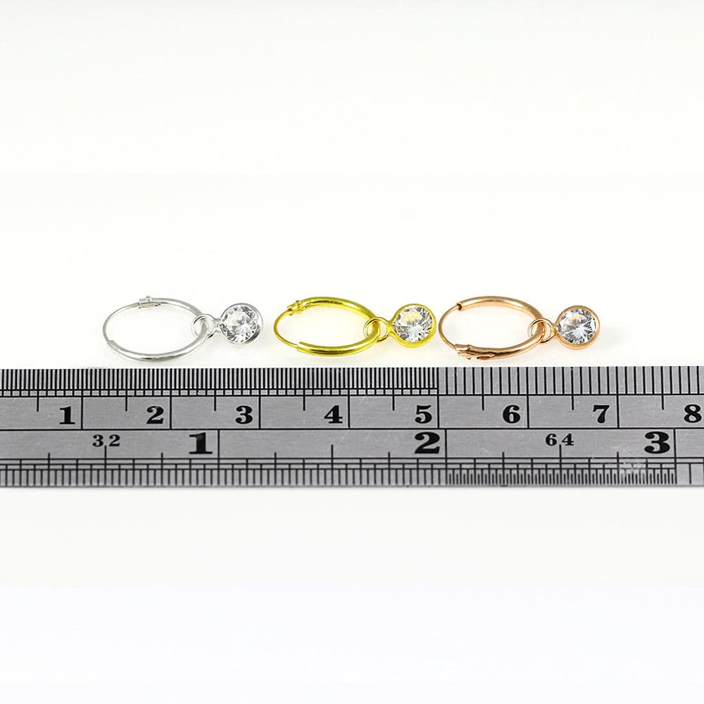 Set of 3 round CZ dangling fashion hoop earrings in silver, gold, and rose gold finishes shown with ruler for size reference.