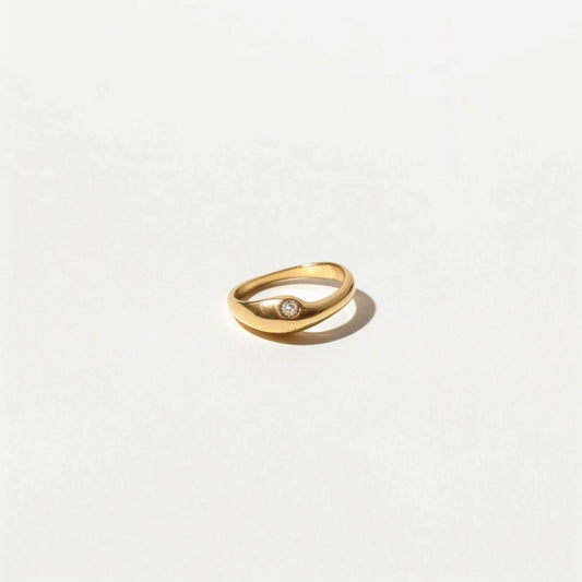Example product gold ring with a single centered diamond on a smooth band, ideal for minimalist fine jewelry collections.