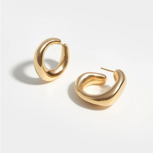 Chunky gold hoop earrings with a smooth, polished finish, ideal for modern fashion accessories. Example product for jewelry category.