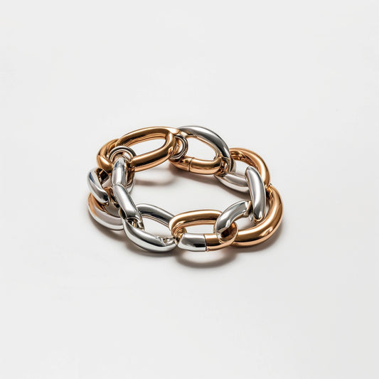 Chunky chain bracelet featuring alternating rose gold and silver oval links, ideal for bold fashion statements in women's jewelry collections.